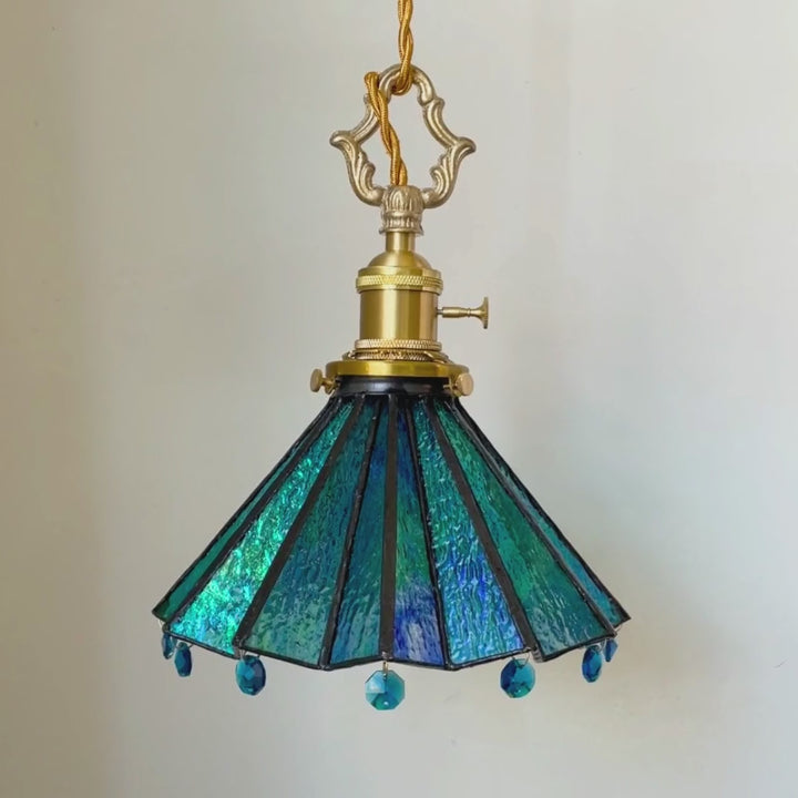 Video of handmade blue stained glass pendant light with crystal accents and brass hardware